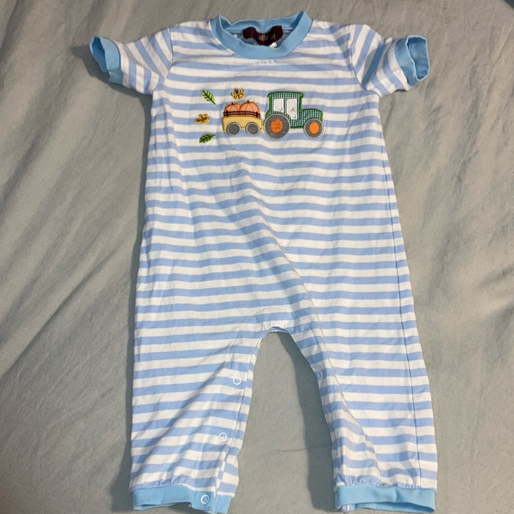 Millie Jay romper with snap closure bottom and pumpkin feature